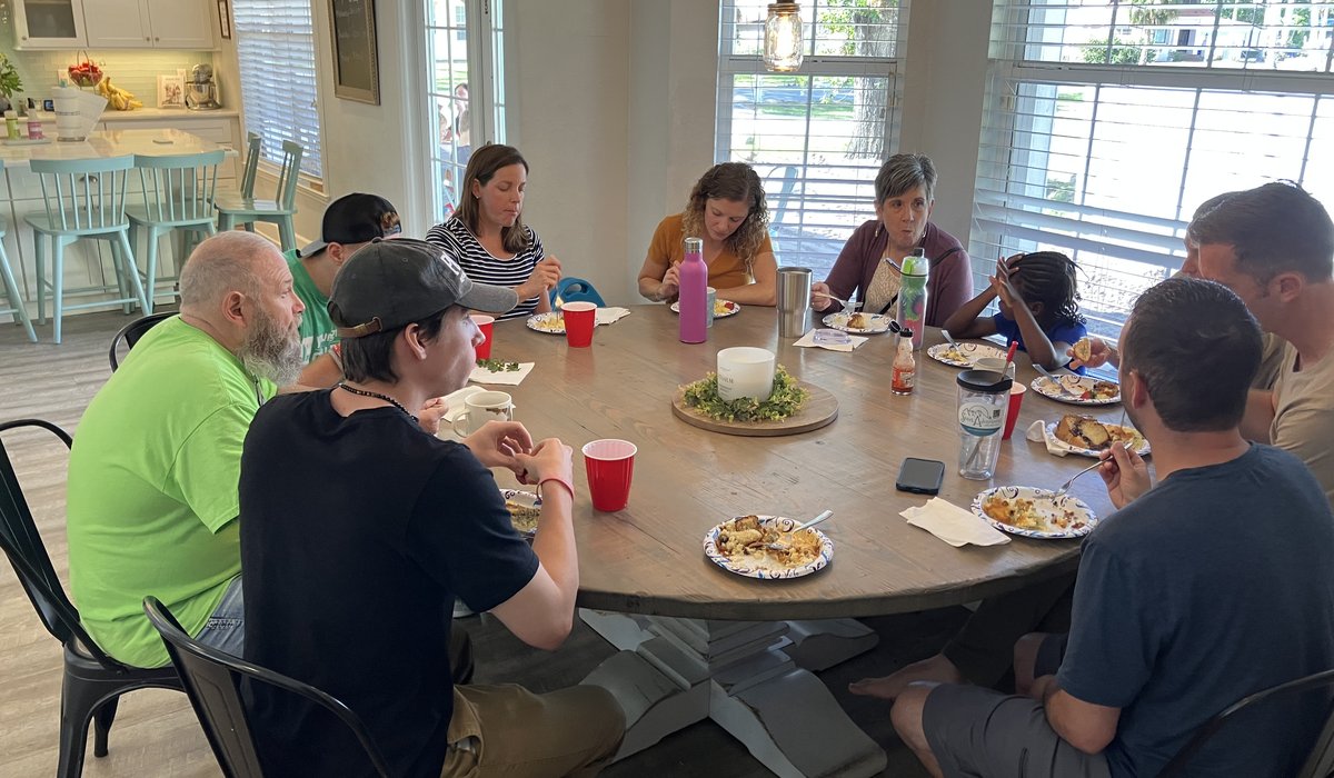 Community gathered around a table